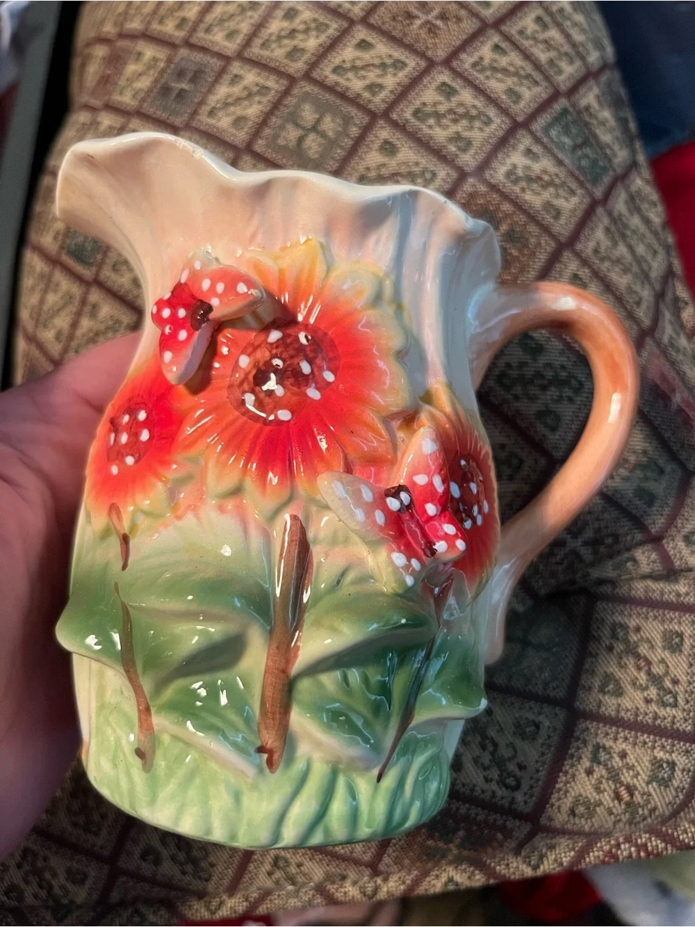 vintage Majolica-style ceramic pitcher features a vibrant 3D embossed sunflower